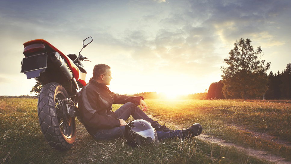 Man leaning on motorcycle